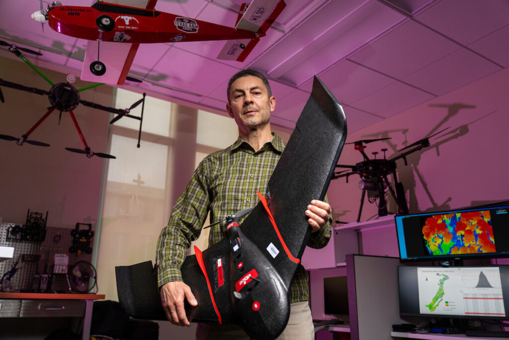 Dr. Sorin Popescu, holds a UAV in his lab.